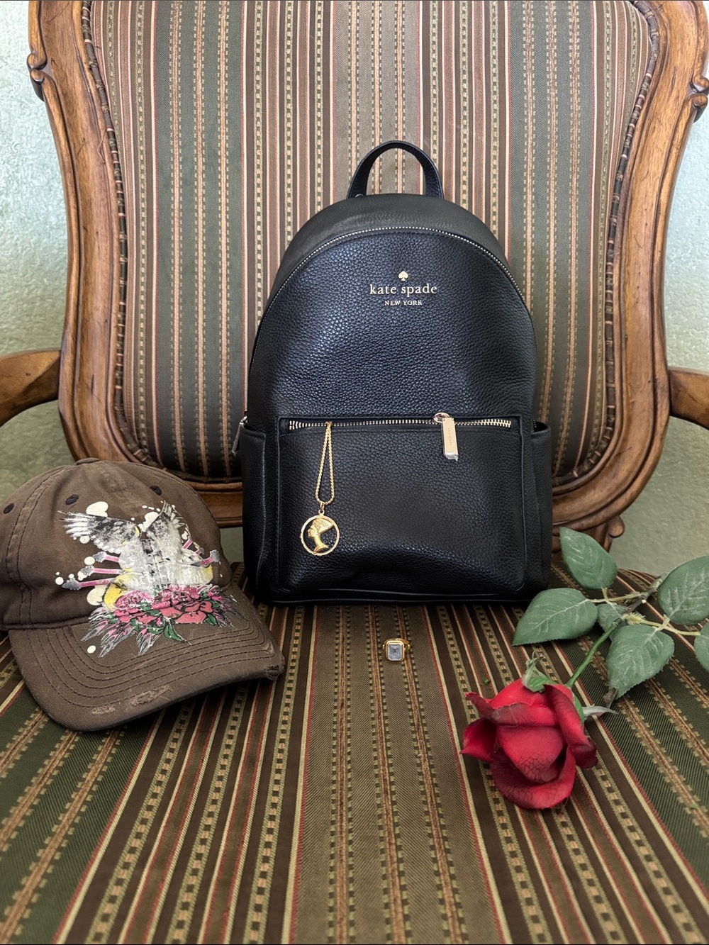 Brand New. Kate spade New York Black Pebbled Leather Backpack with Gold Accents